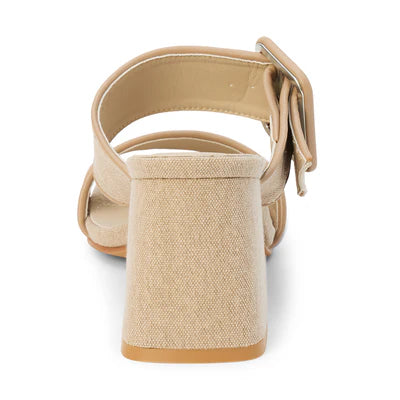 Back view of sand color sandal with a block heel and double strap with statement buckle on a white background