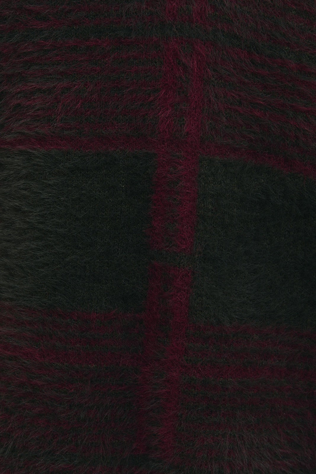 Close-up of a line plaid knit fabric in burgundy and green