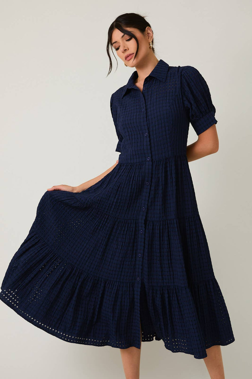 Women's navy flowy tiered midi dress with collar and button front