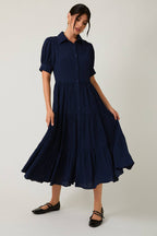 Women's navy flowy tiered midi dress with collar and button front