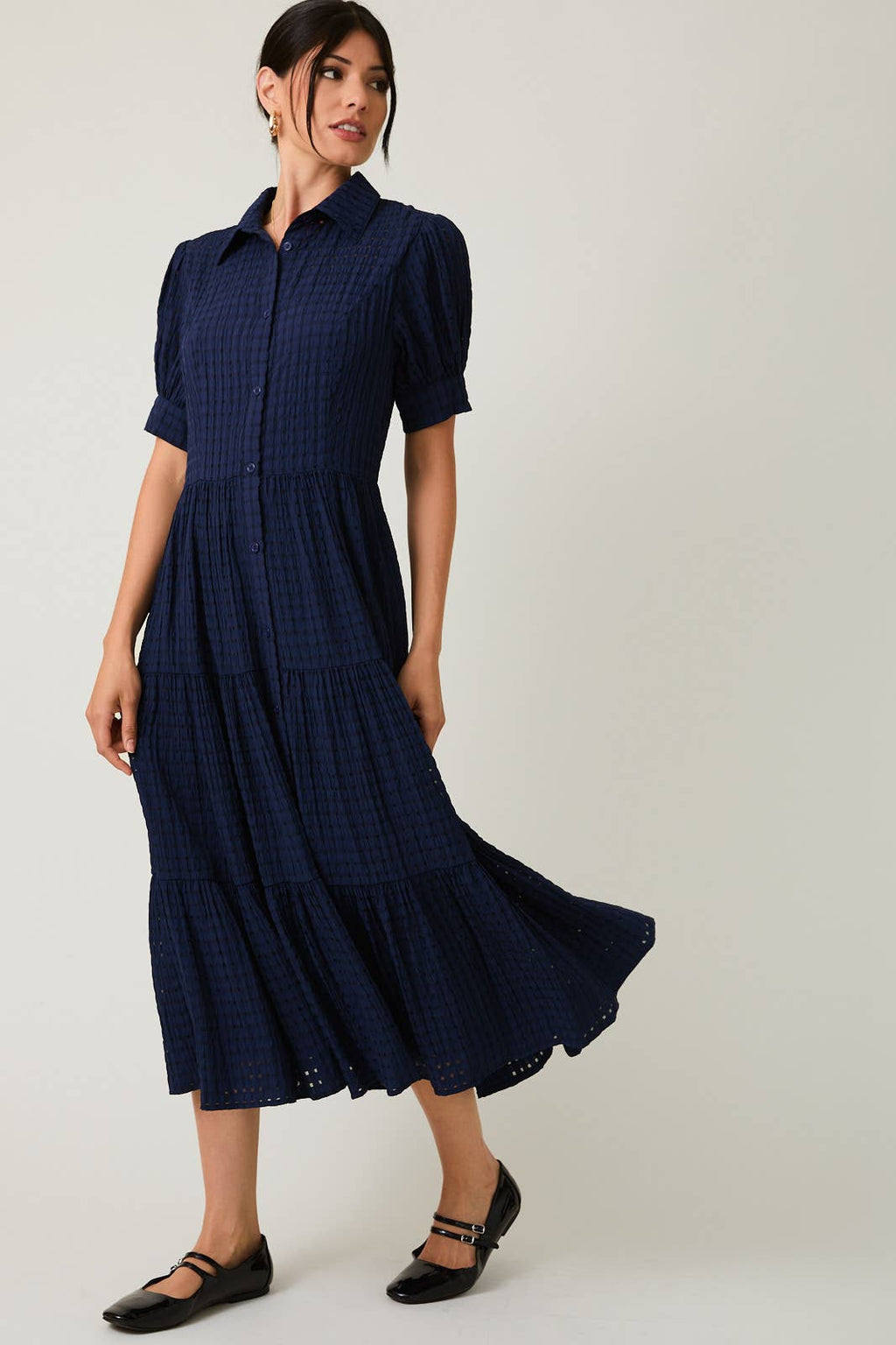 Women's navy flowy tiered midi dress with collar and button front
