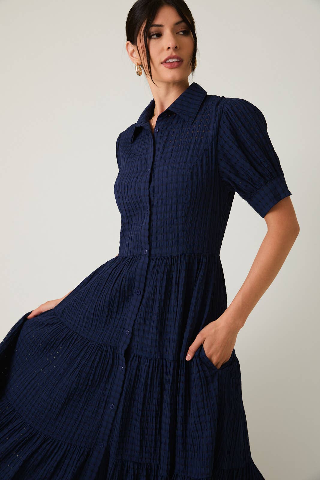Women's navy flowy tiered midi dress with collar and button front