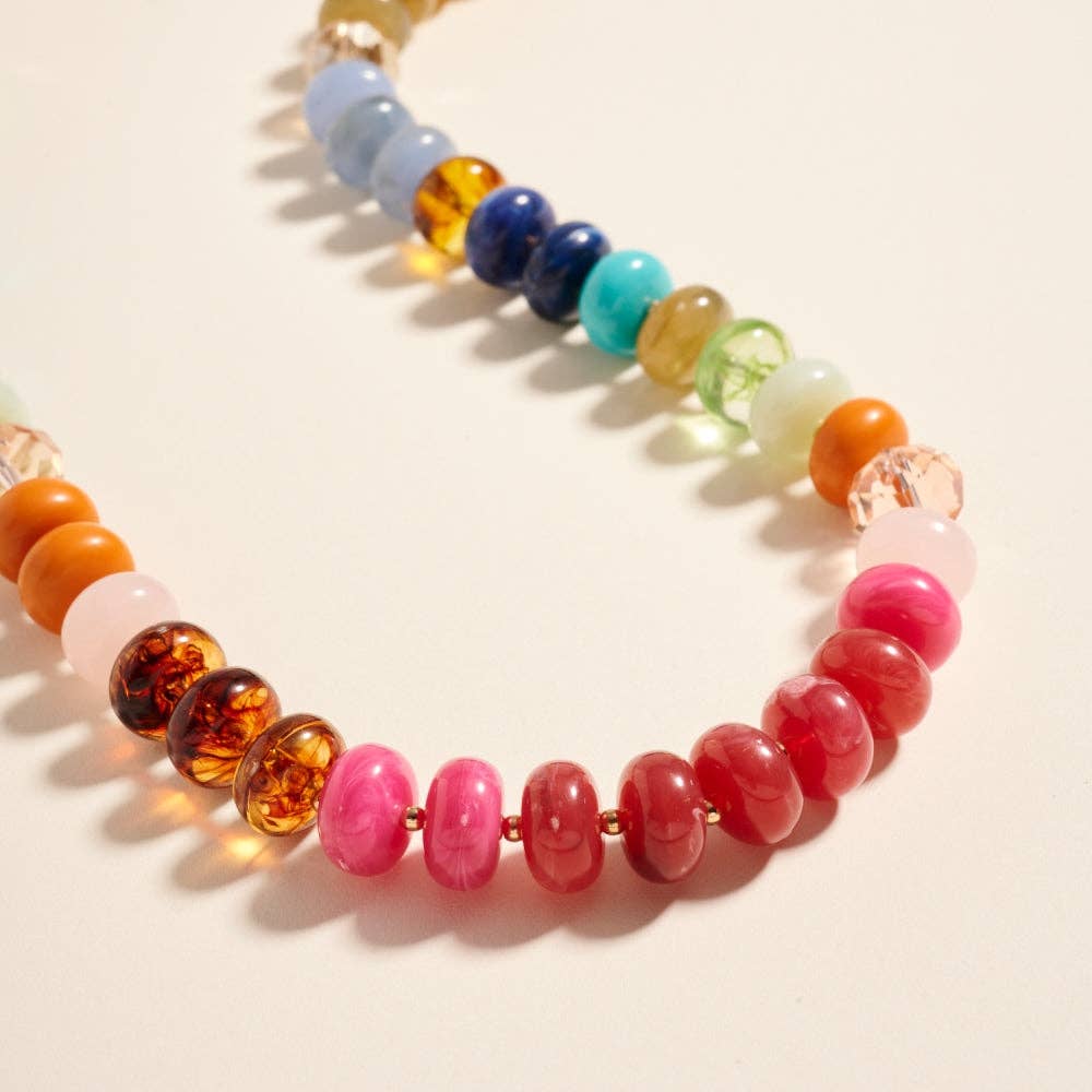 Colorful beaded necklace on a light background
