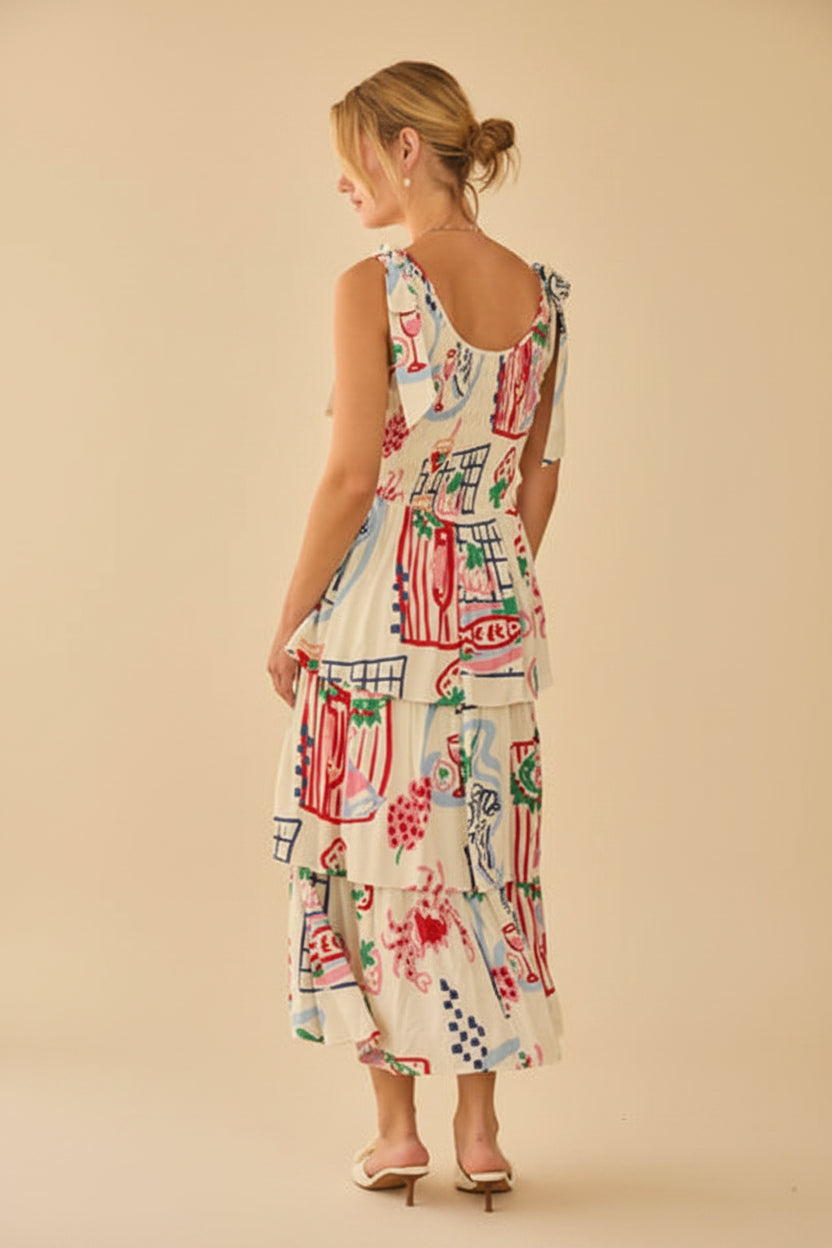 Back view of a woman wearing a shoulder tie colorfut print dress with abstract patterns in a softly lit room