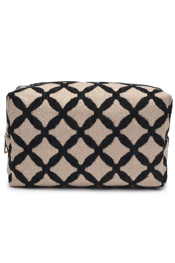 Cosmetic bag with black diamond pattern on beige background on white backdrop
