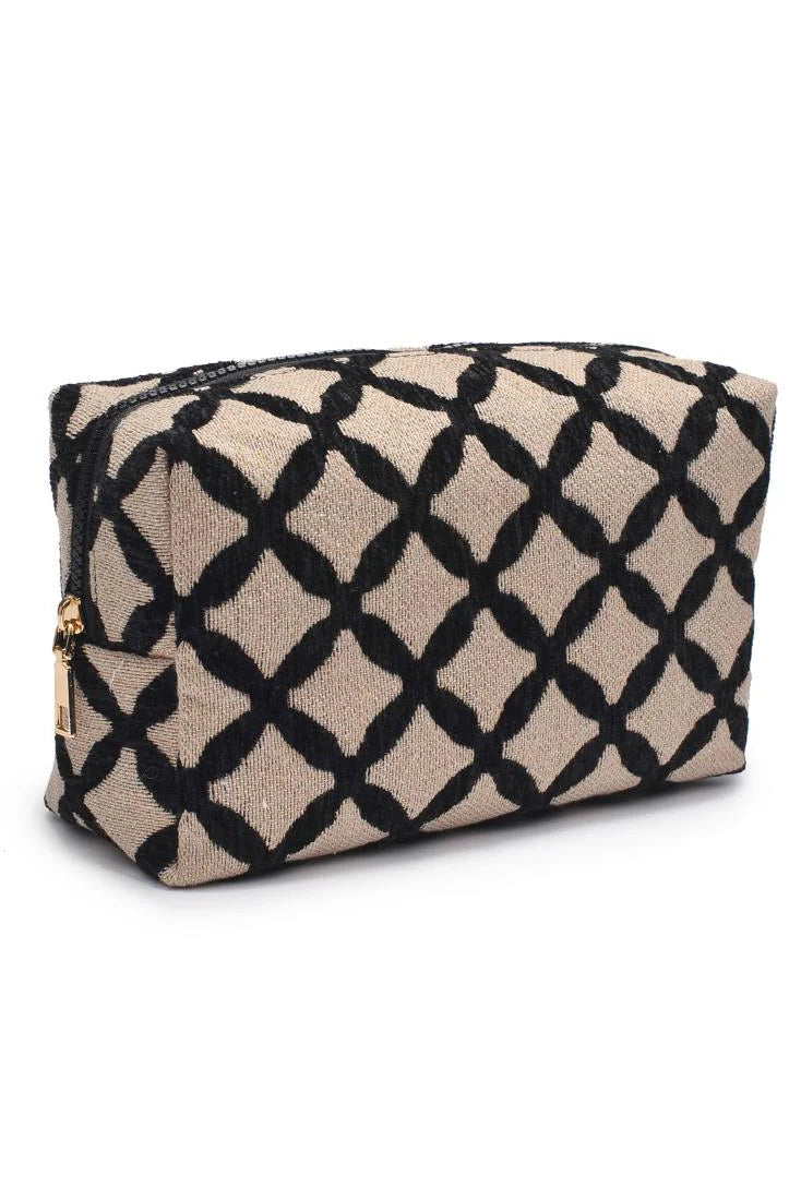 Cosmetic bag with black diamond pattern on beige backgroundon white backdrop