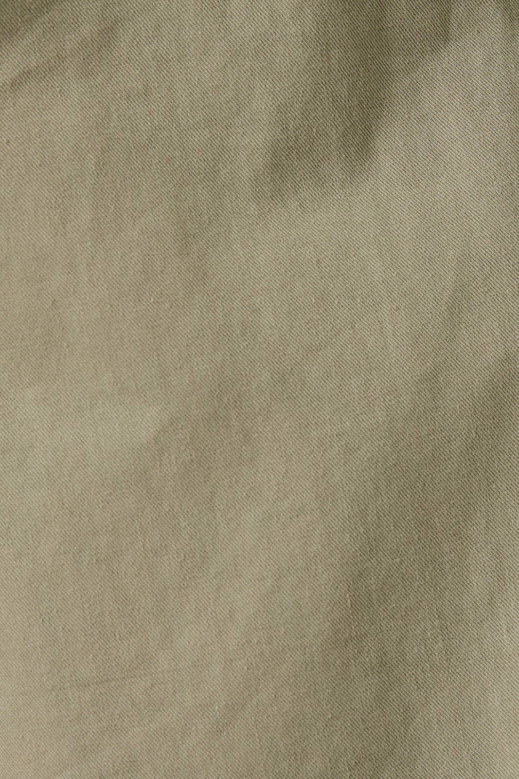 Close-up of sage green fabric texture