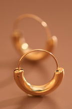 18k gold-plated stainless steel chunky hoop earrings on a brown background