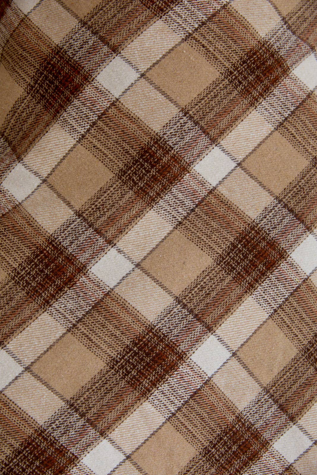 Close-up of a brown and beige plaid fabric pattern