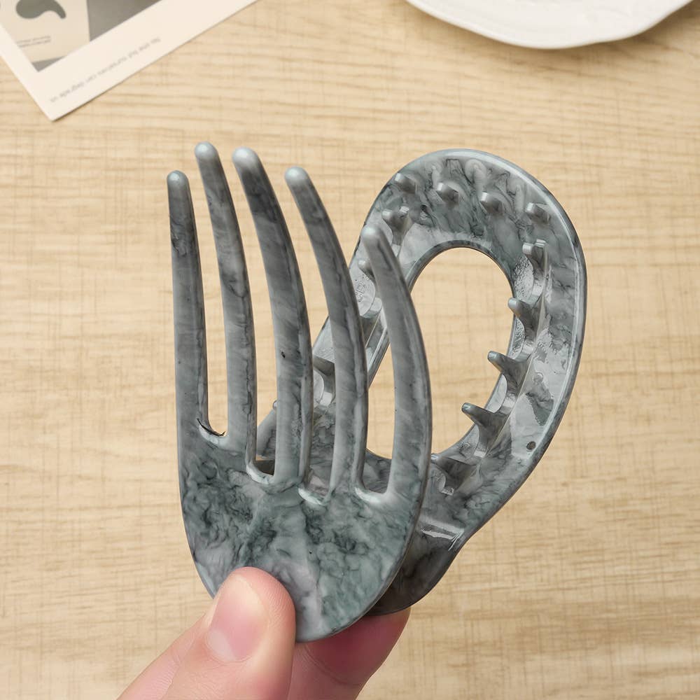 Close up of an oval flat hair claw