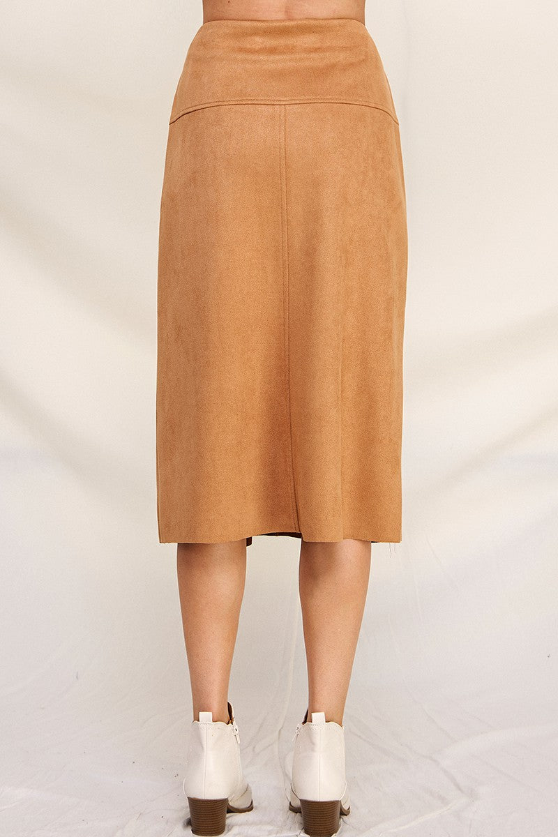 Back view of woman wearing camel a-line microsuede midi skirt on a white background