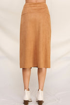 Back view of woman wearing camel a-line microsuede midi skirt on a white background