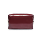 Wine vegan leather cosmetic bag with gold hardware on white background
