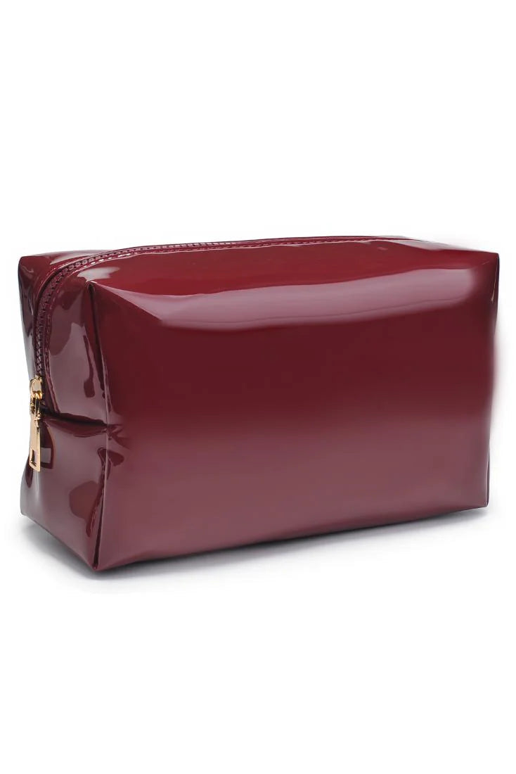 Wine vegan leather cosmetic bag with gold zipper on white background