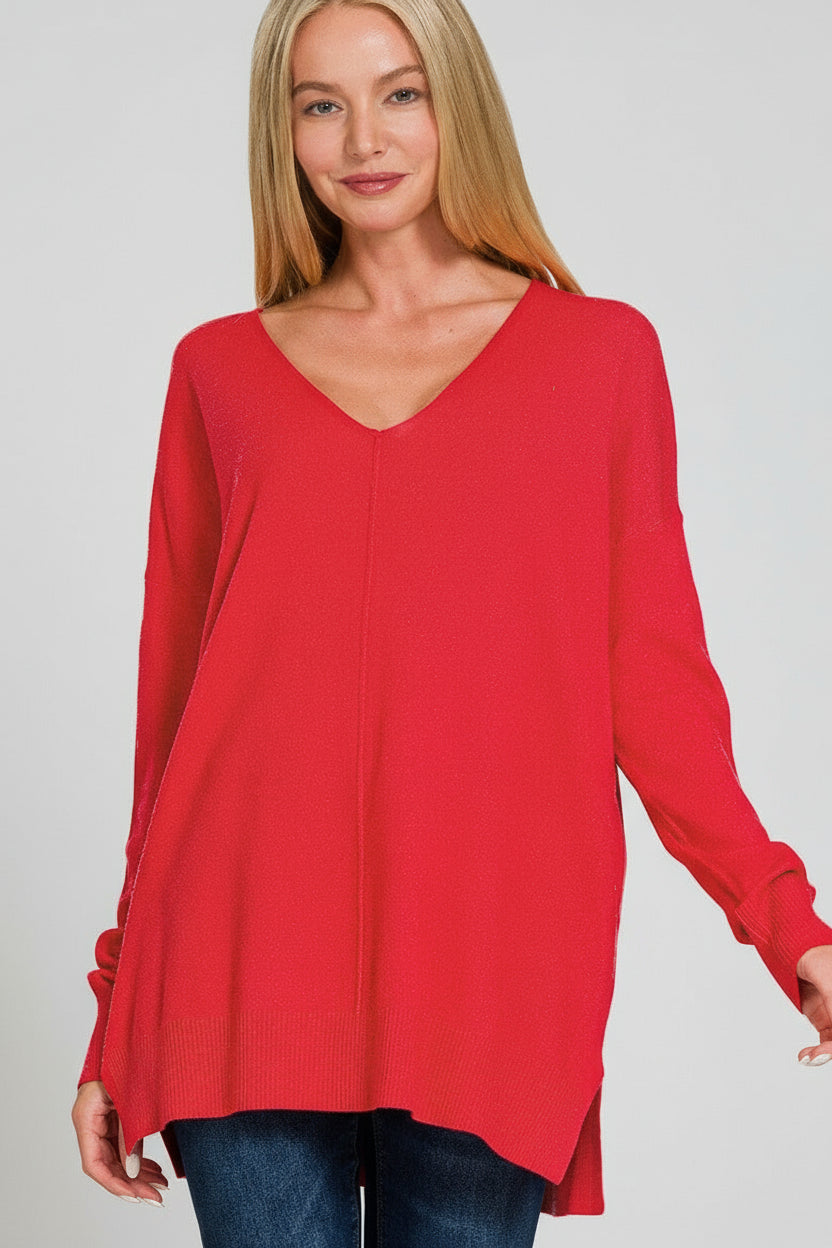 Woman wearing a V neckline front center seam heather red sweater on a white background