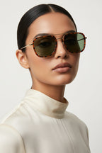 Woman wearing square tortoise and metal sunglasses on white background