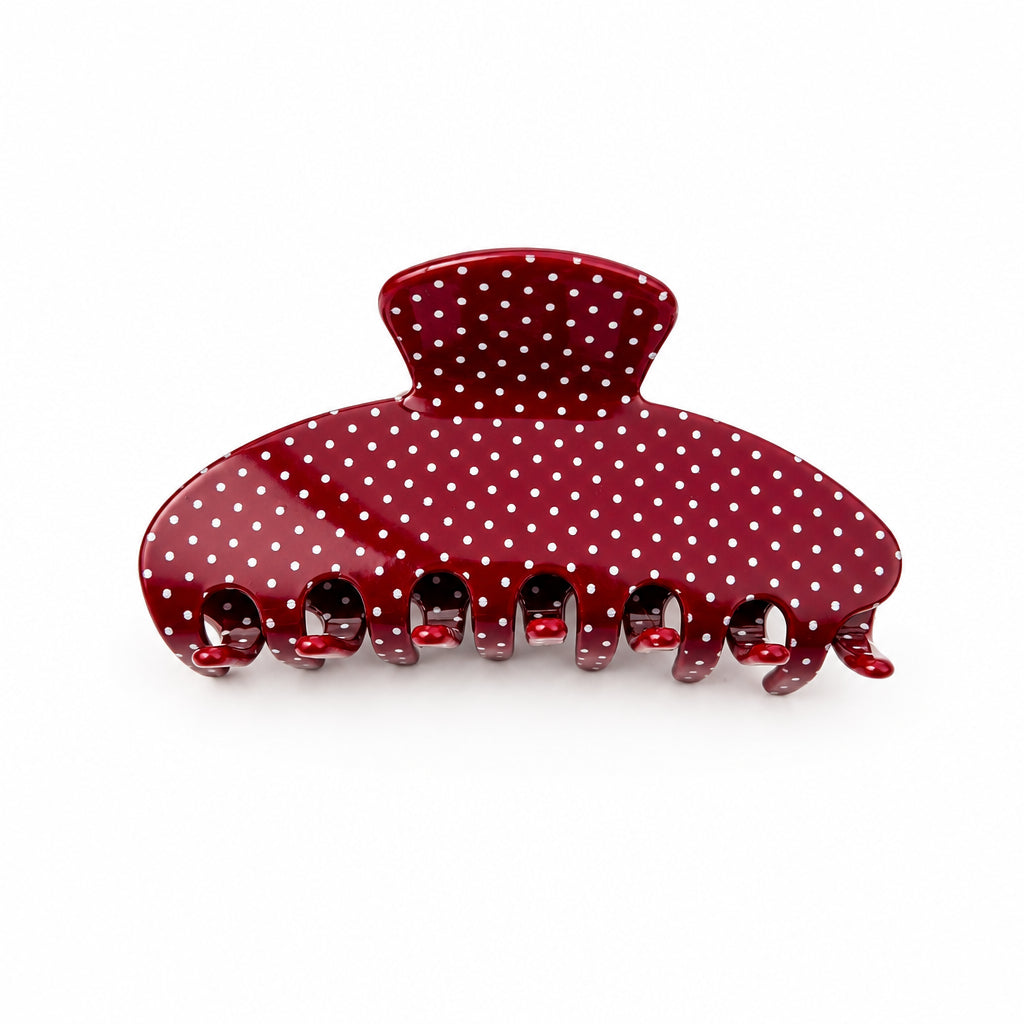 Berry red hair claw with white polka dots on a white background 