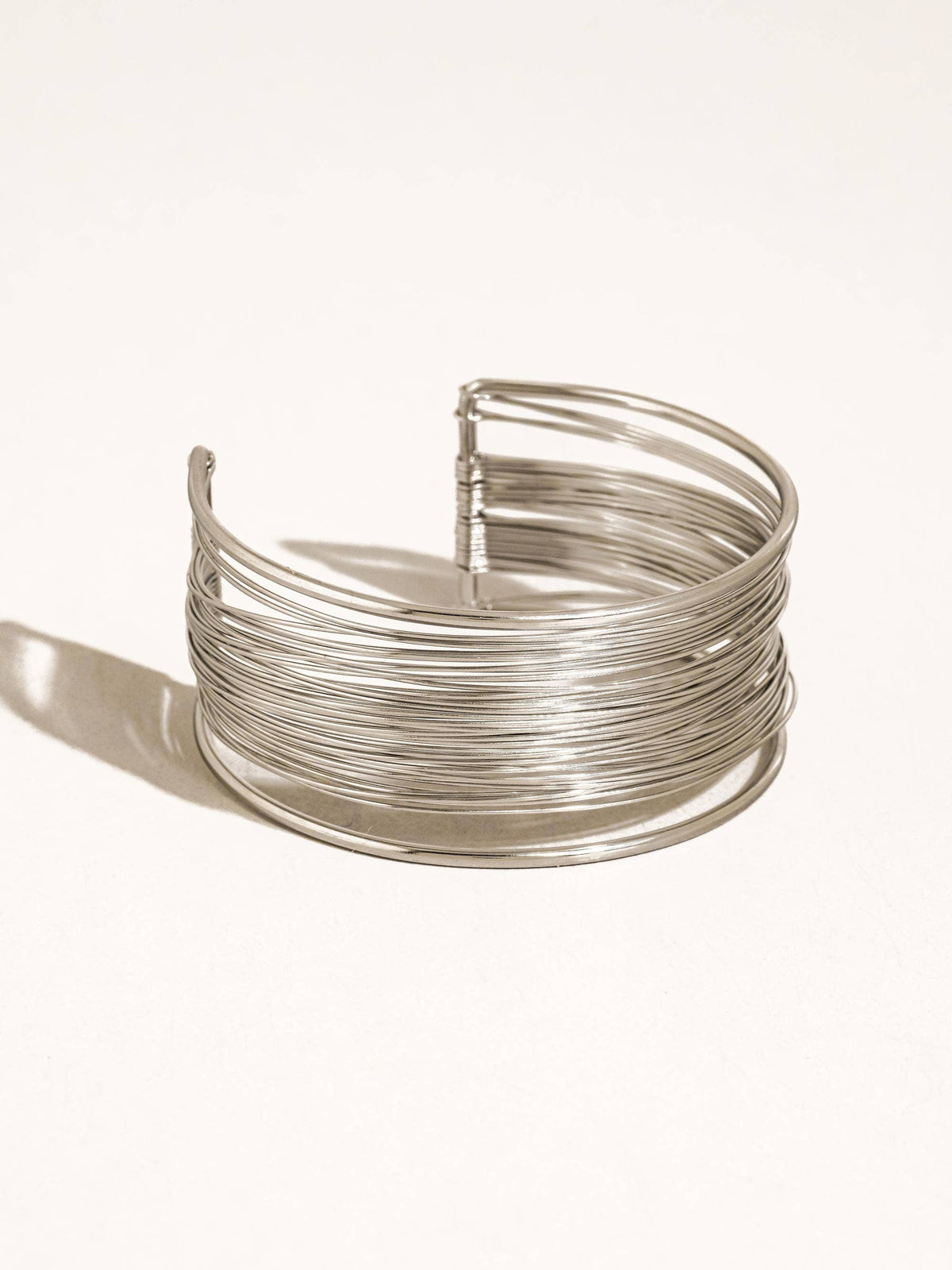 Silver wire bracelet on a white background