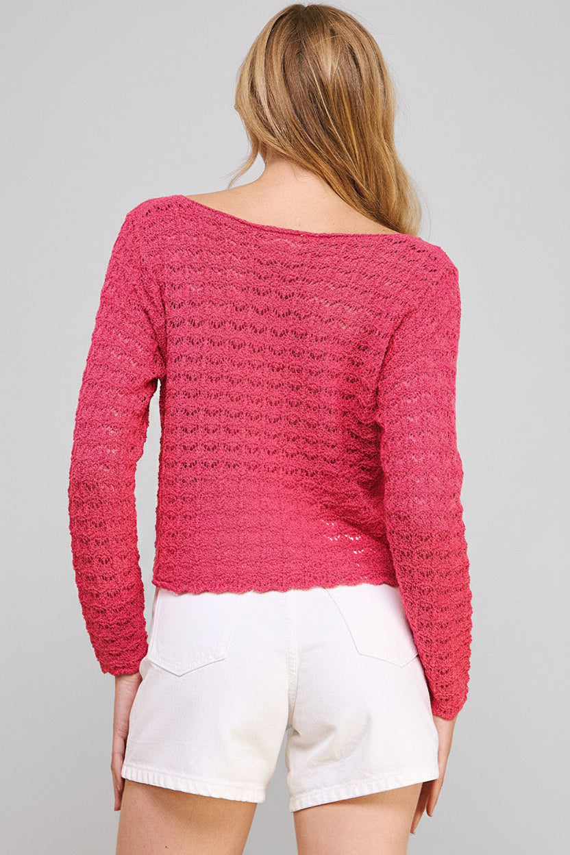 Back view of a woman wearing a hot pink crochet top and white shorts on a beige background