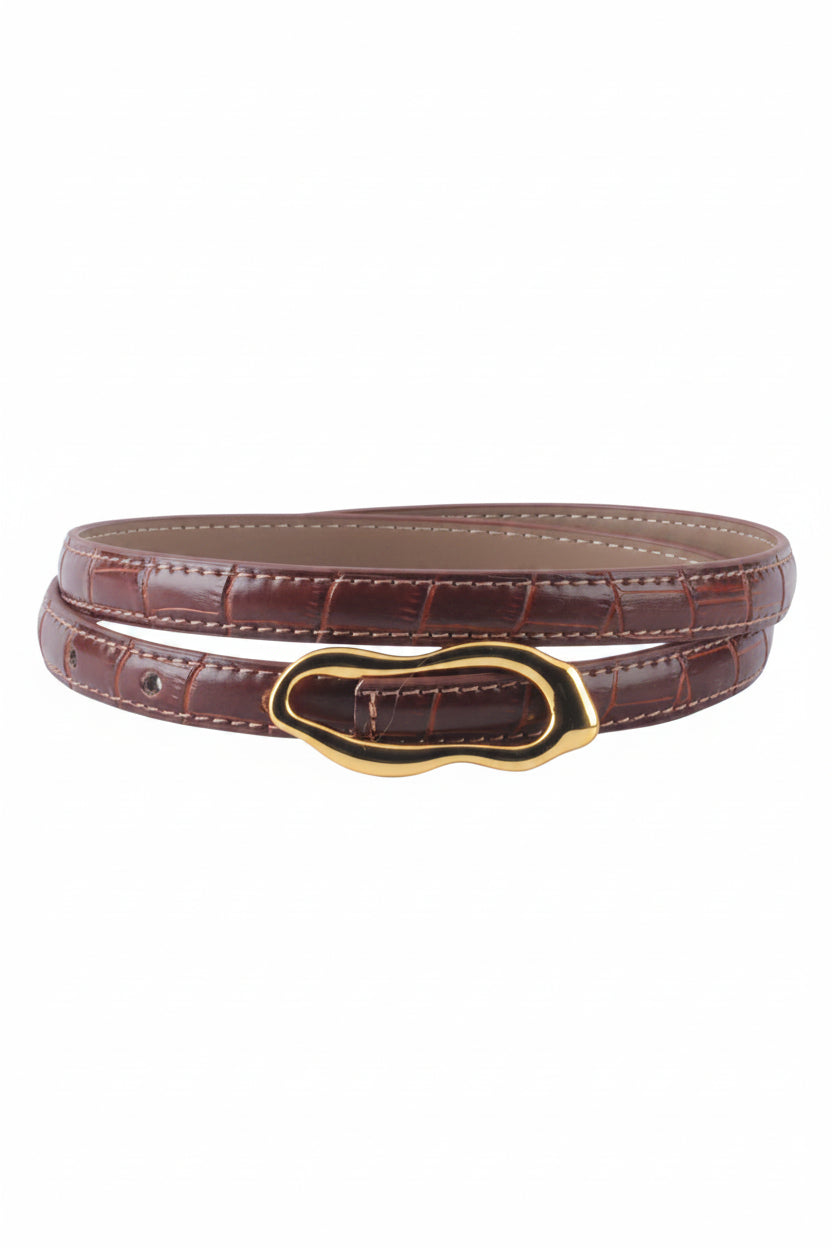 Rust color leather belt with gold buckle on a white background