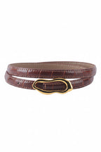 Rust color leather belt with gold buckle on a white background