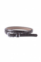 A dark brown leather belt with a silver buckle, coiled on a plain white background.