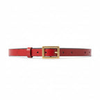 Red genuine leather belt on a plain background