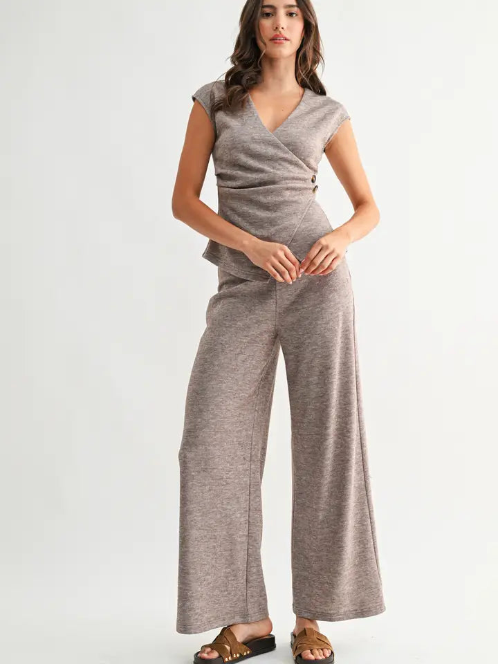 Woman wearing heather mocha knit wide leg pants and matching top on a white background