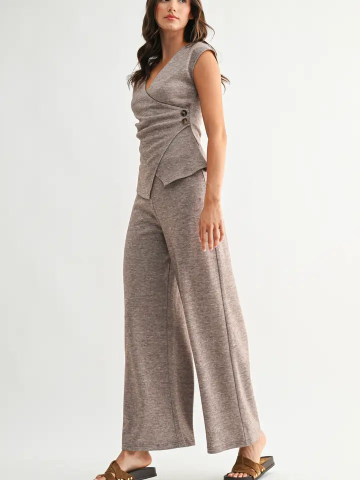 Woman wearing heather mocha knit wide leg pants and matching top on a white background