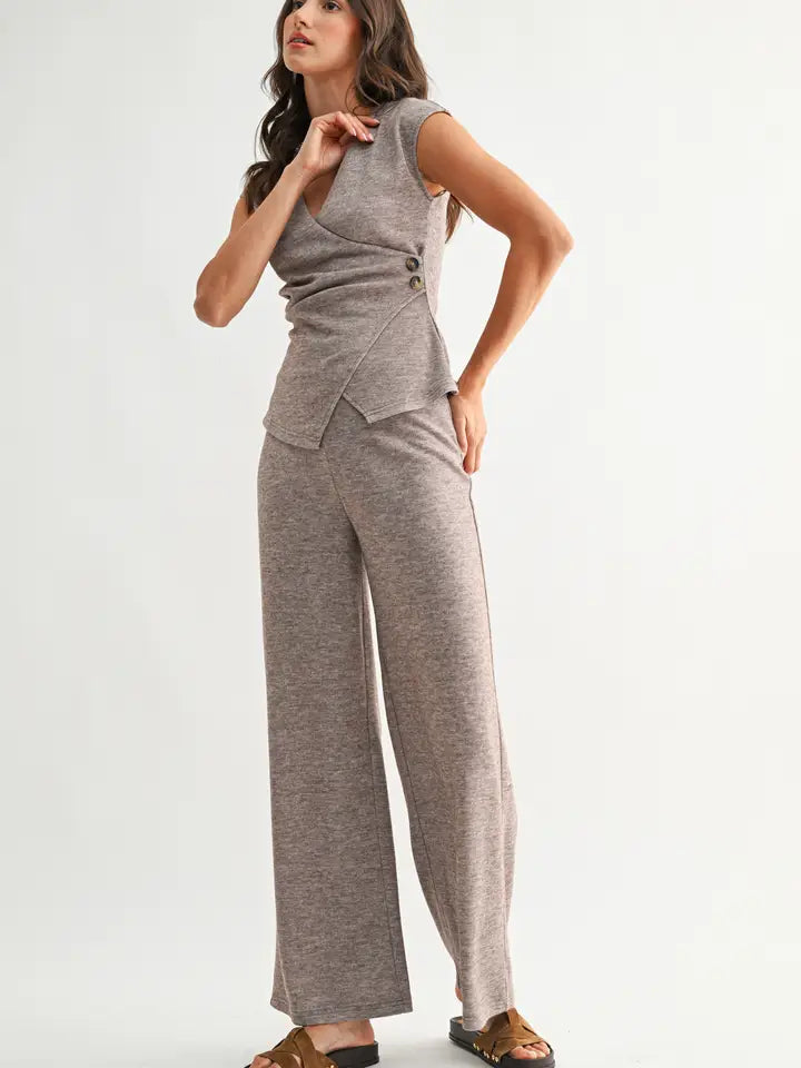 Woman wearing heather mocha knit wide leg pants and matching top on a white background