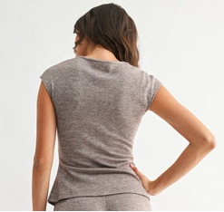 Woman wearing heather mocha knit wide leg pants and matching top on a white background