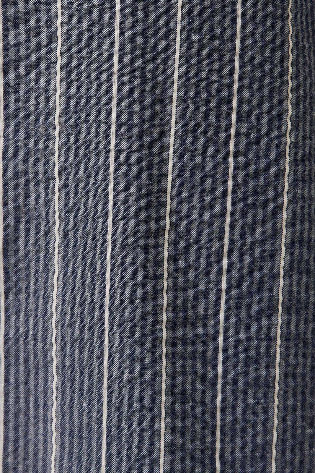 Close-up of a fabric with navy and white pinstripes