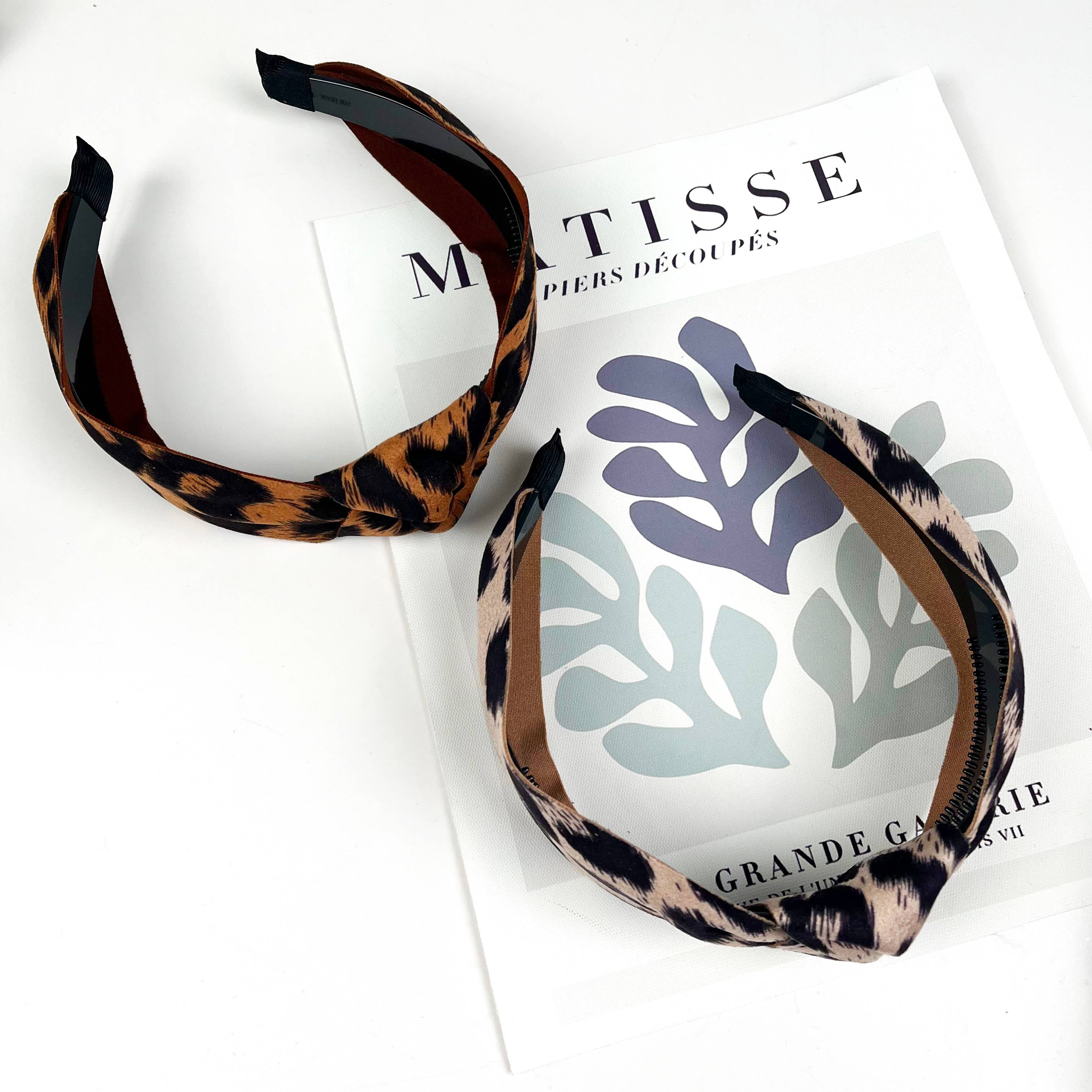 Women's two leopard print top knot headbands on a white background