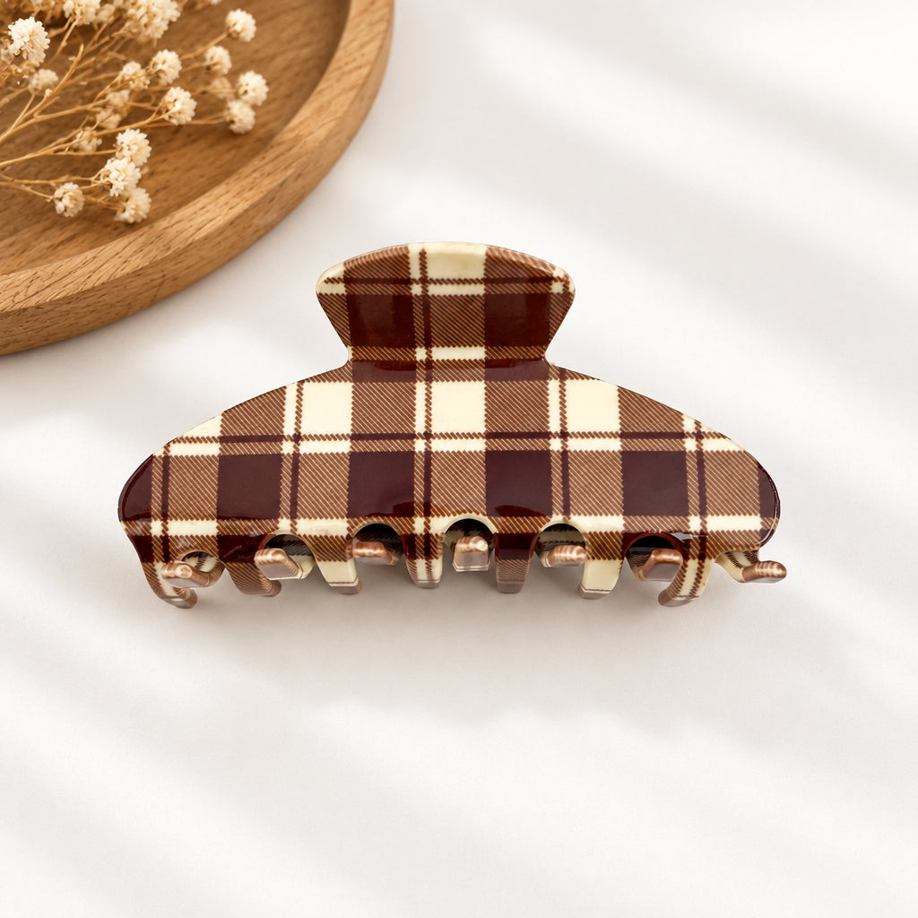 Brown plaid hair clip on a white background