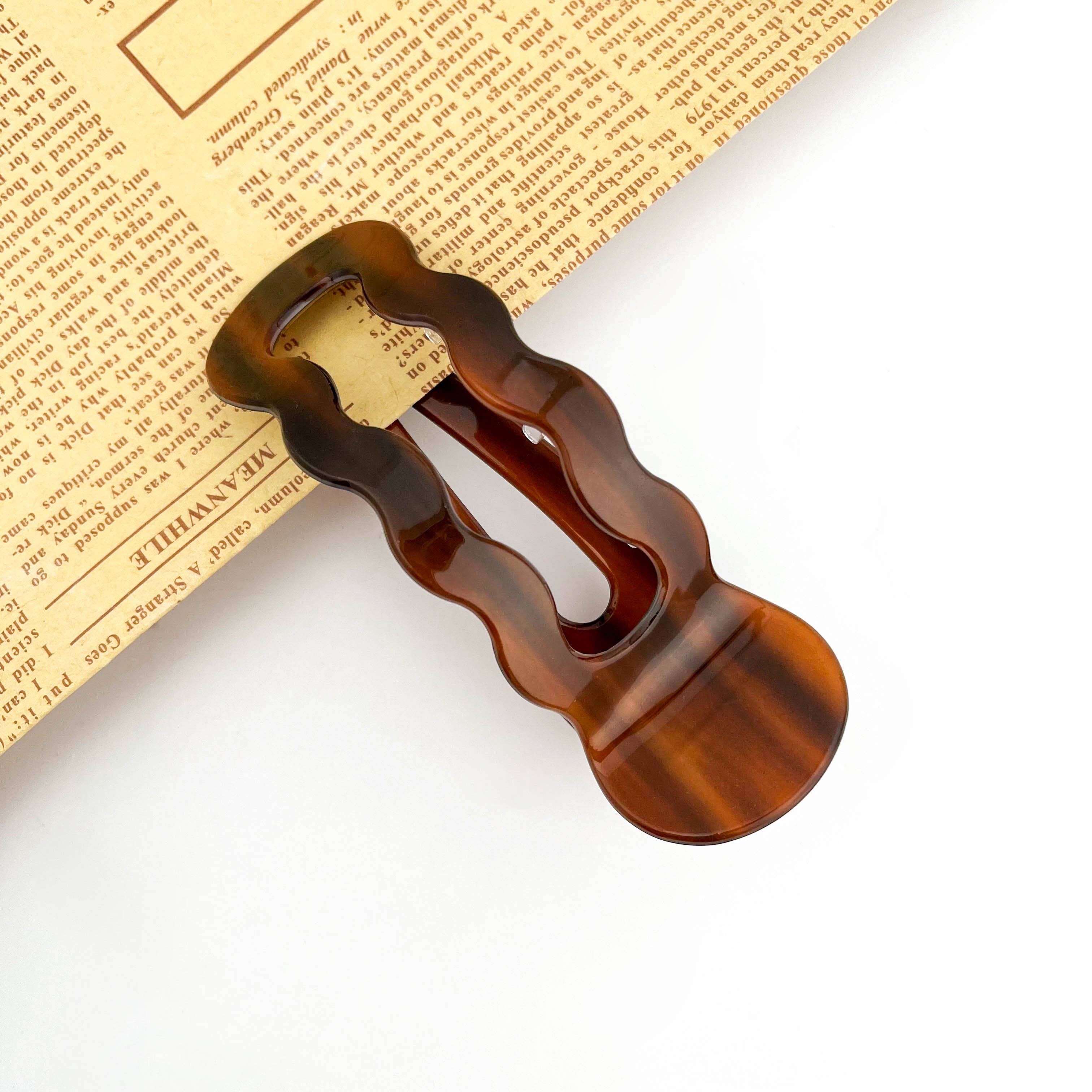 Wavy U-shaped hair clip on the white background