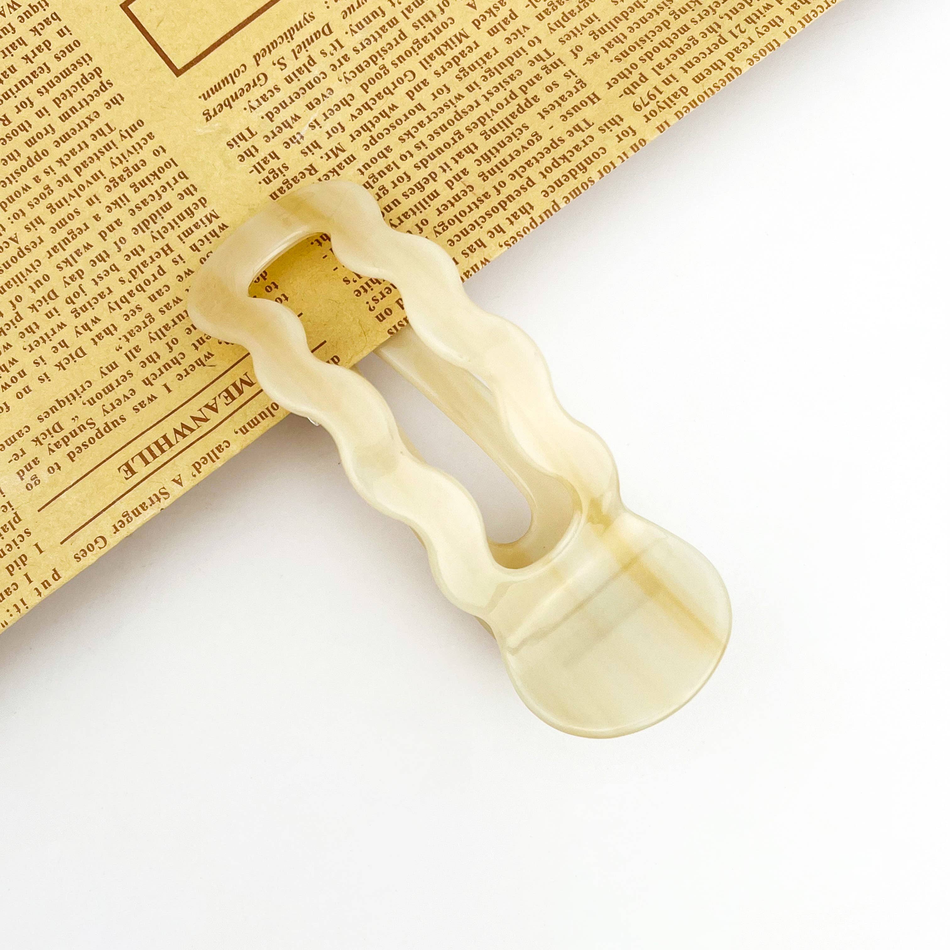 Wavy U-shaped hair clip on the white background