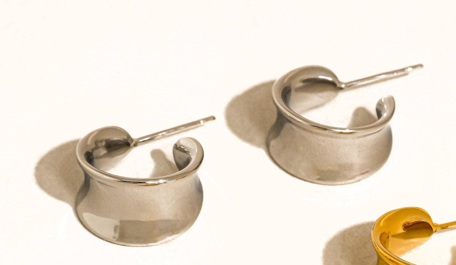 18k silver-plated curved dome earrings on a white background
