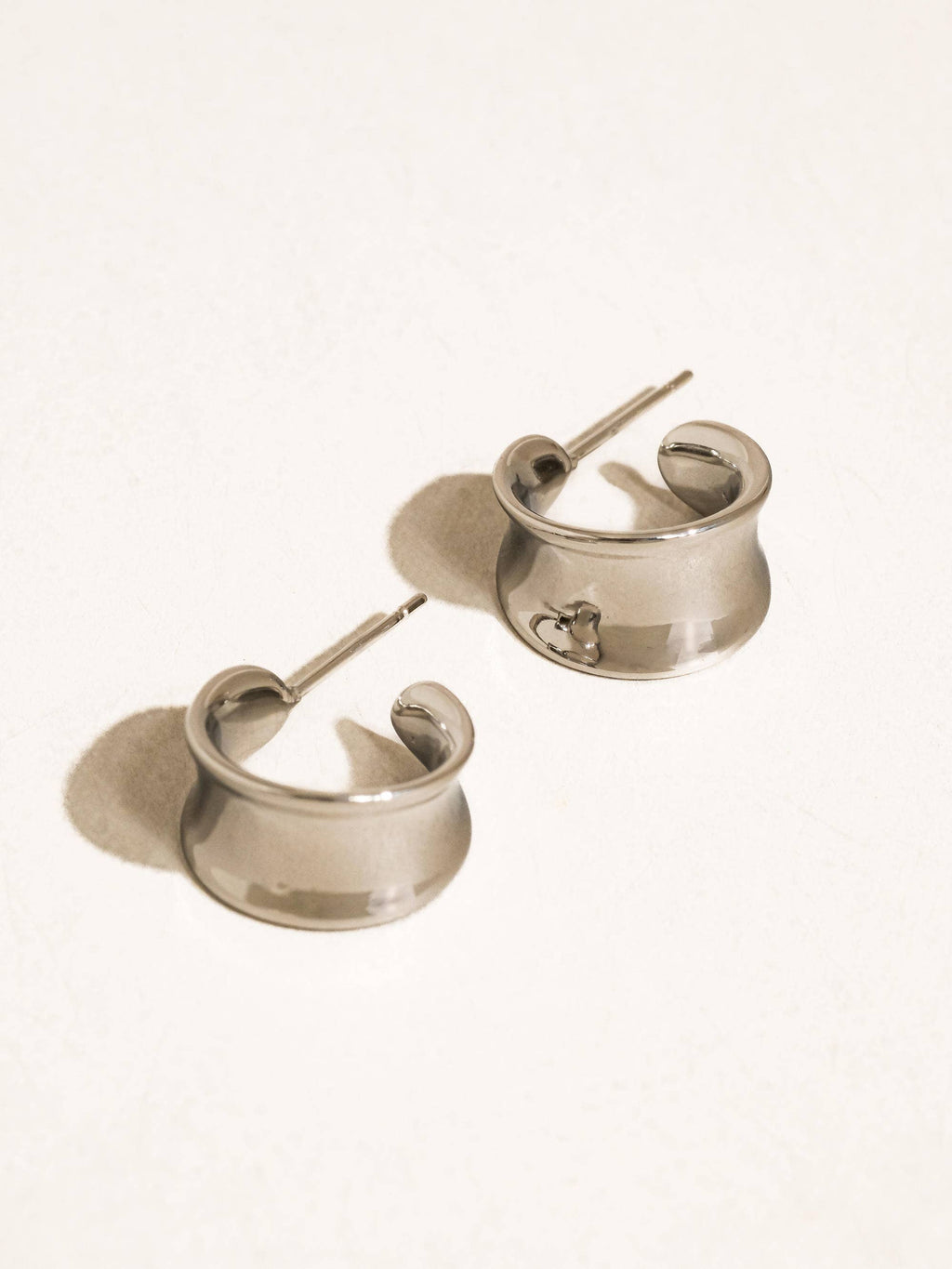 18k silver-plated curved dome earrings on a white background