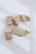 Pair of green and beige sandals with 'Befaco' branding on a white background